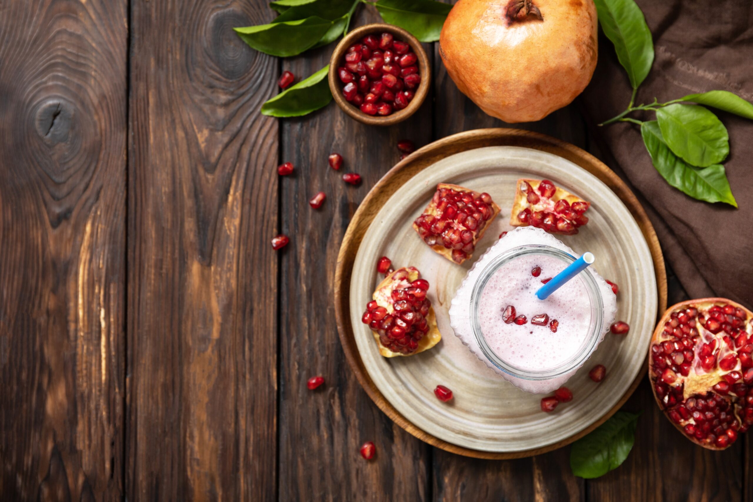 Vegan protein smoothie made from pomegranate and banana on a rus - fruityfy